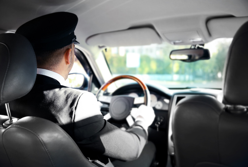 Chauffeur driving a car, view from inside